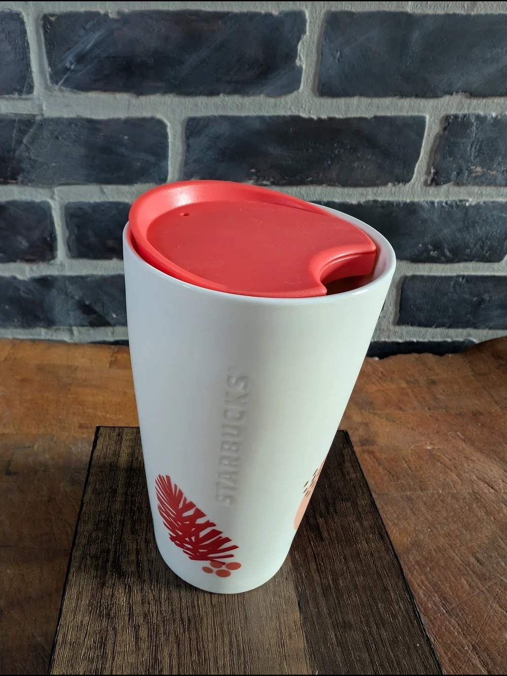 Starbucks White Ceramic Travel Mug with Coral Lid and Pinecone Accent